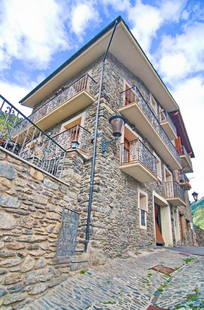Typical traditional dark brick Andorra rural mountain houses in the village of Llorts near Andorra la Vella in the Pyreneesのeditorial素材