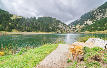 The reservoir (small lake) in Vall de Nuria in the Pyrenees Mountains in  Catalonia, Spainの写真素材
