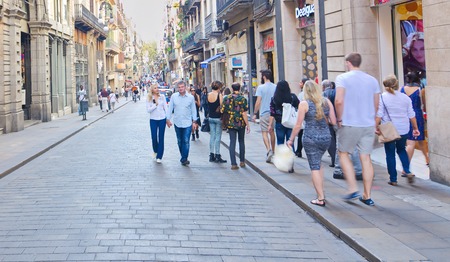 BARCELONA - OCT 16, 2014: People touring the Carrer de Ferran street in the Barcelona, Spain Gorhic Quarter (Barri Gotic)のeditorial素材