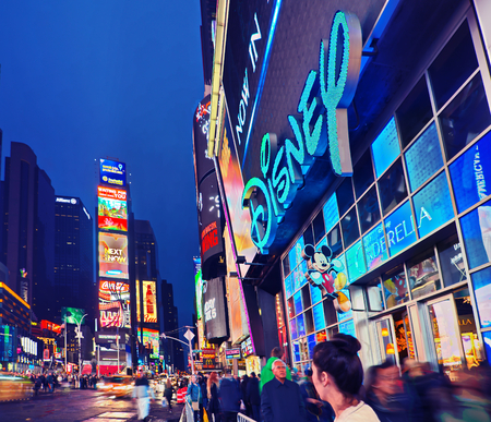 NEW YORK, MARCH 14, 2015: Times Square at night - HDR featuring the flagship Disney Store  and animated Broadway billboard signs for Coca Cola and other brands.のeditorial素材