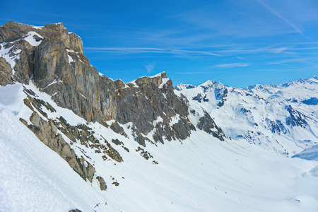 View of the pistes, ski trails, and mountains of the Lech Zurs ski resort, part of the Arlberg  ski area, from a mountainside restaurant.の写真素材
