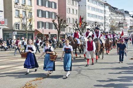 ZURICH, SWITZERLAND - APRIL 13, 2015: People celebrating the Sechselauten (Sachsiluute) - Zurich Spring Festival - celebrated with a parade of the Zunfte (guilds) and burning of the Boogg snowman.のeditorial素材