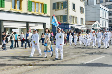 ZURICH, SWITZERLAND - APRIL 13, 2015: People celebrating the Sechselauten (Sachsiluute) - Zurich Spring Festival - celebrated with a parade of the Zunfte (guilds) and burning of the Boogg snowman.のeditorial素材