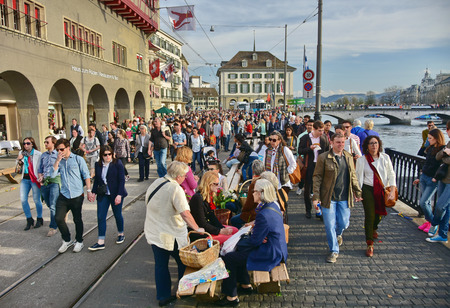 ZURICH, SWITZERLAND - APRIL 13, 2015: People celebrating the Sechselauten (Sachsiluute) - Zurich Spring Festival - celebrated with a parade of the Zunfte (guilds) and burning of the Boogg snowman.のeditorial素材