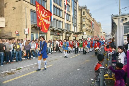 ZURICH, SWITZERLAND - APRIL 13, 2015: People celebrating the Sechselauten (Sachsiluute) - Zurich Spring Festival - celebrated with a parade of the Zunfte (guilds) and burning of the Boogg snowman.のeditorial素材