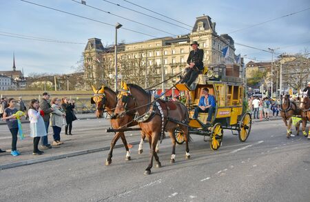 ZURICH, SWITZERLAND - APRIL 13, 2015: People celebrating the Sechselauten (Sachsiluute) - Zurich Spring Festival - celebrated with a parade of the Zunfte (guilds) and burning of the Boogg snowman.のeditorial素材