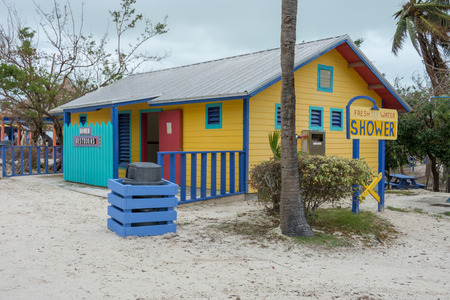 COCO CAY, BAHAMAS - OCT 16, 2016: Colorful and fun restrooms water closet showers cabins on the Caribbean beachのeditorial素材