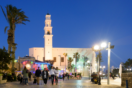 TEL AVIV - MARCH 4, 2017: People touring the beautiful old international city of Jaffa near the Mediterranean port on a warm spring eveningのeditorial素材