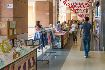 TEL AVIV - MAY 26,  2017: Modern open air shopping mall in Israel.  People in a posh Israel open air shopping mall featuring weekend market stands.のeditorial素材