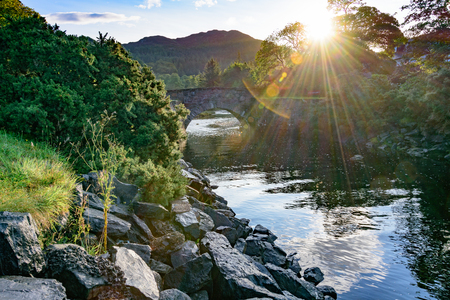 Sunrise over old rock bridge in Gairloch on the Atlantic Coast of Scotland in Wester Rossの写真素材
