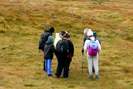 CAIRNGORMS, SCOTLAND - AUG. 21, 2017: People touring the Cairn Gorm Mountain summit in the Cairngorm National Park, Scotlandのeditorial素材