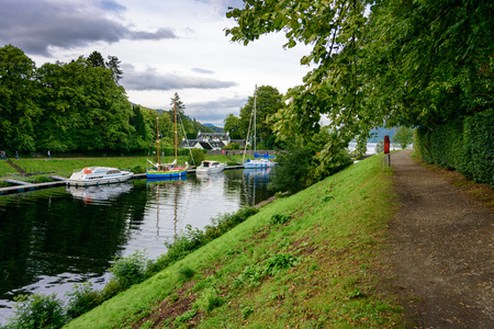 FORT AUGUSTUS, SCOTLAND - AUG 22, 2017: The Caledonian Canal and boats at Fort Augustus and Loch Ness.  The canal connects the Scottish east coast at Inverness with the west coast near Fort William.のeditorial素材
