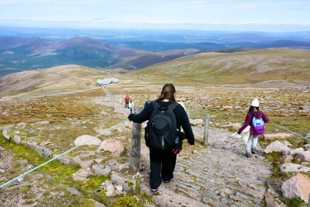 CAIRNGORMS, SCOTLAND - AUG. 21, 2017: People touring the Cairn Gorm Mountain summit in the Cairngorm National Park, Scotlandのeditorial素材