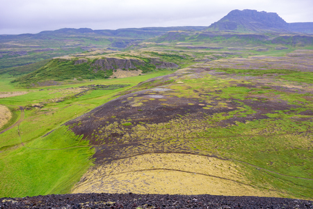 Dramatic panoramic views of the lava valley from Grabrok volcano in Icelandの写真素材