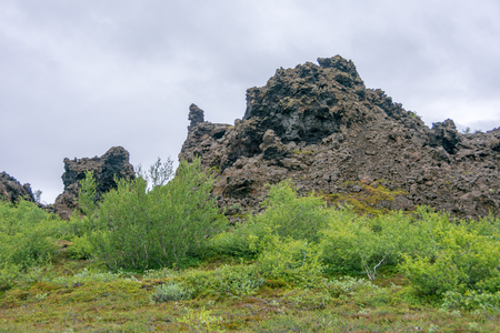 Dimmuborgir area of unusually shaped lava fields near Myvatn Lake in North Iceland. The area is composed dramatic volcanic caves and rock formationsの写真素材