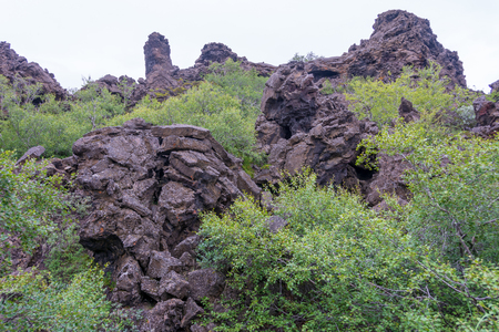 Dimmuborgir area of unusually shaped lava fields near Myvatn Lake in North Iceland. The area is composed dramatic volcanic caves and rock formationsの写真素材