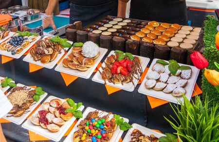LONDON: August 25, 2019: Colorful food stalls at the Brick Lane Market of  the hip Shoreditch quarterの写真素材