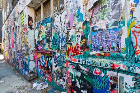 LONDON: August 25, 2019: Graffiti and posters at the poorer part of the hip Shoreditch quarter of Londonの写真素材