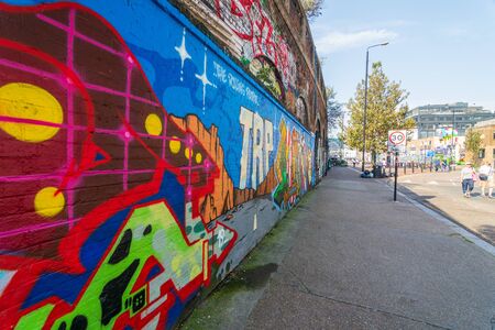 LONDON: August 25, 2019: Amazing street art, murals, and graffiti at the hip Shoreditch quarter of Londonの写真素材