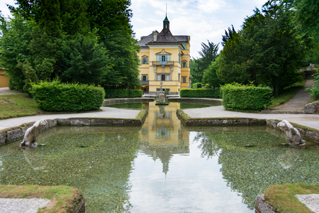 SALZBURG, AUSTRIA - JUNE 6, 2019: Hellbrunn Castle and Trick Gardens with many wet surprises in the...