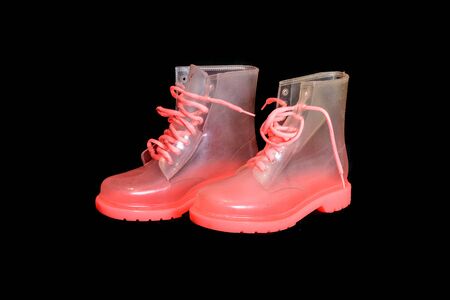 Special translucent pink girl woman high top waterproof platic bootsの写真素材