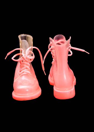 Special translucent pink girl woman high top waterproof plastic bootsの写真素材