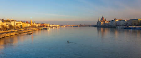 BUDAPEST - DEC. 30, 2019: SzÃ©chenyi Chain Bridge, Buda Castle, Parliament building and surrounding classical architecture of Budapest, Hungary at early morning golden hourのeditorial素材