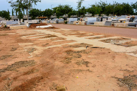 TEL AVIV - OCT. 26, 2019: Empty burial lots at a Jewish cemetery in Israel at the outskirts of Tel Aviv.のeditorial素材