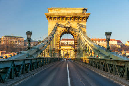 BUDAPEST - DEC. 30, 2019: SzÃ©chenyi Chain Bridge, Buda Castle, Parliament building and surrounding classical architecture of Budapest, Hungary at early morning golden hourのeditorial素材