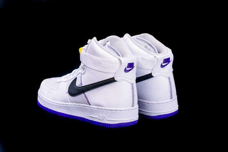 NEW YORK - NOV. 8, 2019: A modern take on the classic Nike Air Force 1 High Top Basketball shoes sneakers with purple and yellow touches with leather and mesh combinationのeditorial素材