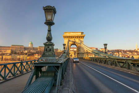 BUDAPEST - DEC. 30, 2019: SzÃ©chenyi Chain Bridge, Buda Castle, Parliament building and surrounding classical architecture of Budapest, Hungary at early morning golden hourのeditorial素材