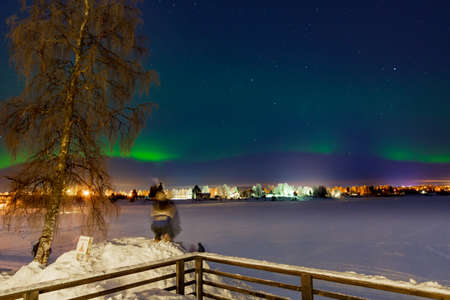 Tourists admiring the Northen Lights - Aurura Borealis - near Rovaniemi, the capital of Lapland in arctic Finlandのeditorial素材