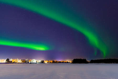 Tourists admiring the Northen Lights - Aurura Borealis - near Rovaniemi, the capital of Lapland in arctic Finlandのeditorial素材
