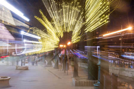 Festiive Christmas New Year background - lighted trees and people special effectのeditorial素材
