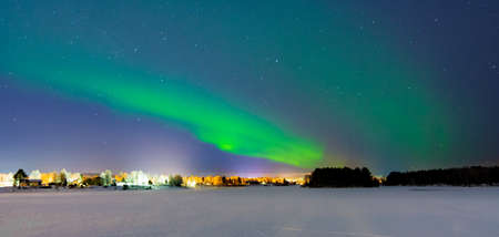 Tourists admiring the Northen Lights - Aurura Borealis - near Rovaniemi, the capital of Lapland in arctic Finlandのeditorial素材