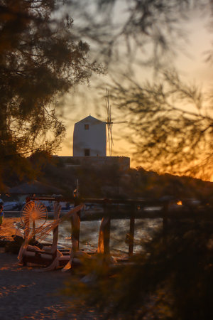 Old windmill at sunset on the island of Paros Greeceの写真素材