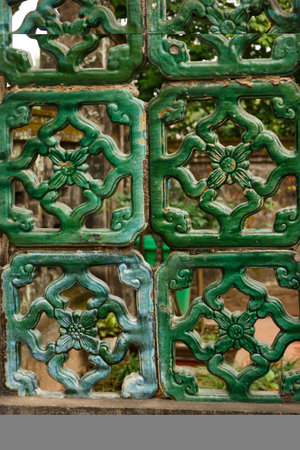 Green decorative elements on the facade of an old house in India.の写真素材