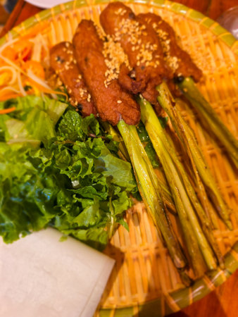 Thai style grilled pork with vegetable on wooden table, Thailand.の写真素材