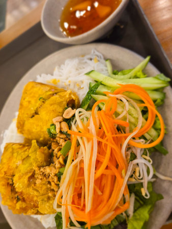 Thai style fried chicken with rice vermicelli and vegetables