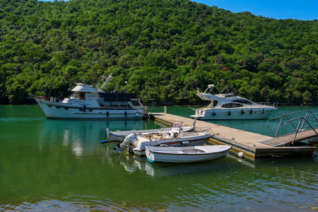 Boats moored at the pier on the island of Krka, Croatiaの写真素材
