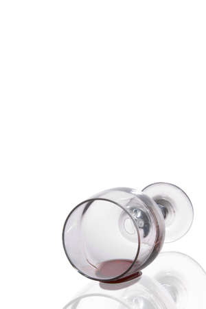 Fallen Wine Glass with reflection on White Backgroundの写真素材