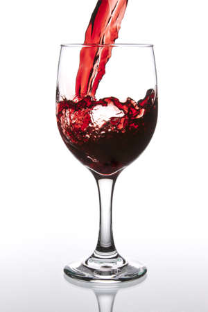 Pouring Red Wine in to Glassの写真素材