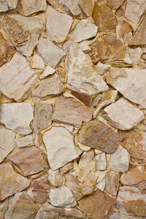 A Traditional Stone Wall with Cement backgroundの写真素材