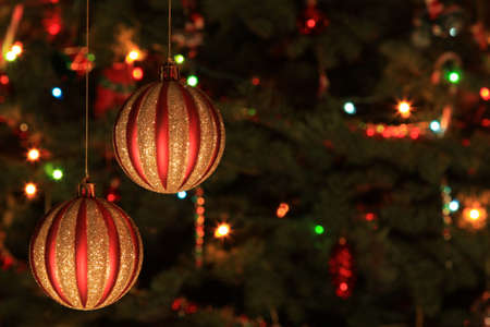 Christmas Bauble with tree and lights on backgroundの写真素材