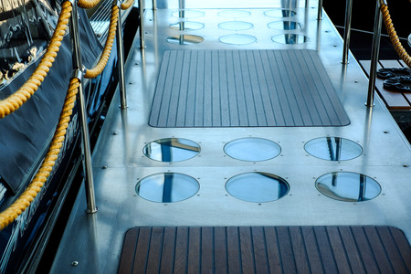 Wooden staircase leading to the deck of the cruise ship. Teak wood.