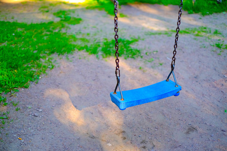 Swing on chains childrens summer Playgroundの写真素材