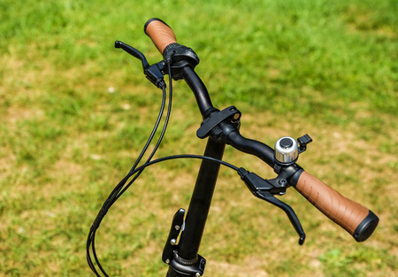 the handlebars of the Bicycle. the brake handle. speed switches.