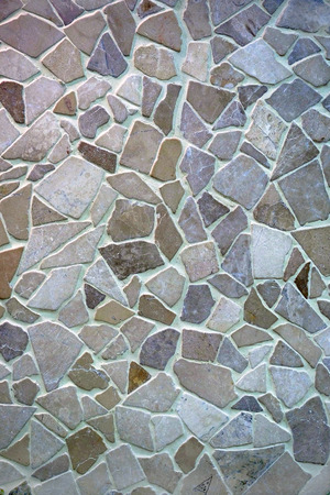 The texture of masonry stone walls of different sizes. Natural stone. Elements of rocks.の写真素材