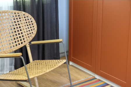Wicker chair.Rocking chair in white.Chair on the balcony. Rattan rocking chairs on the wooden...
