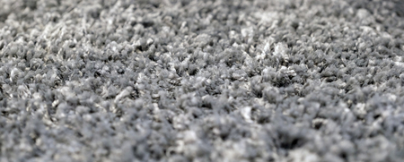 Stack gray bath mats bath mats Stack, stacked on top of each other. Terry mats.